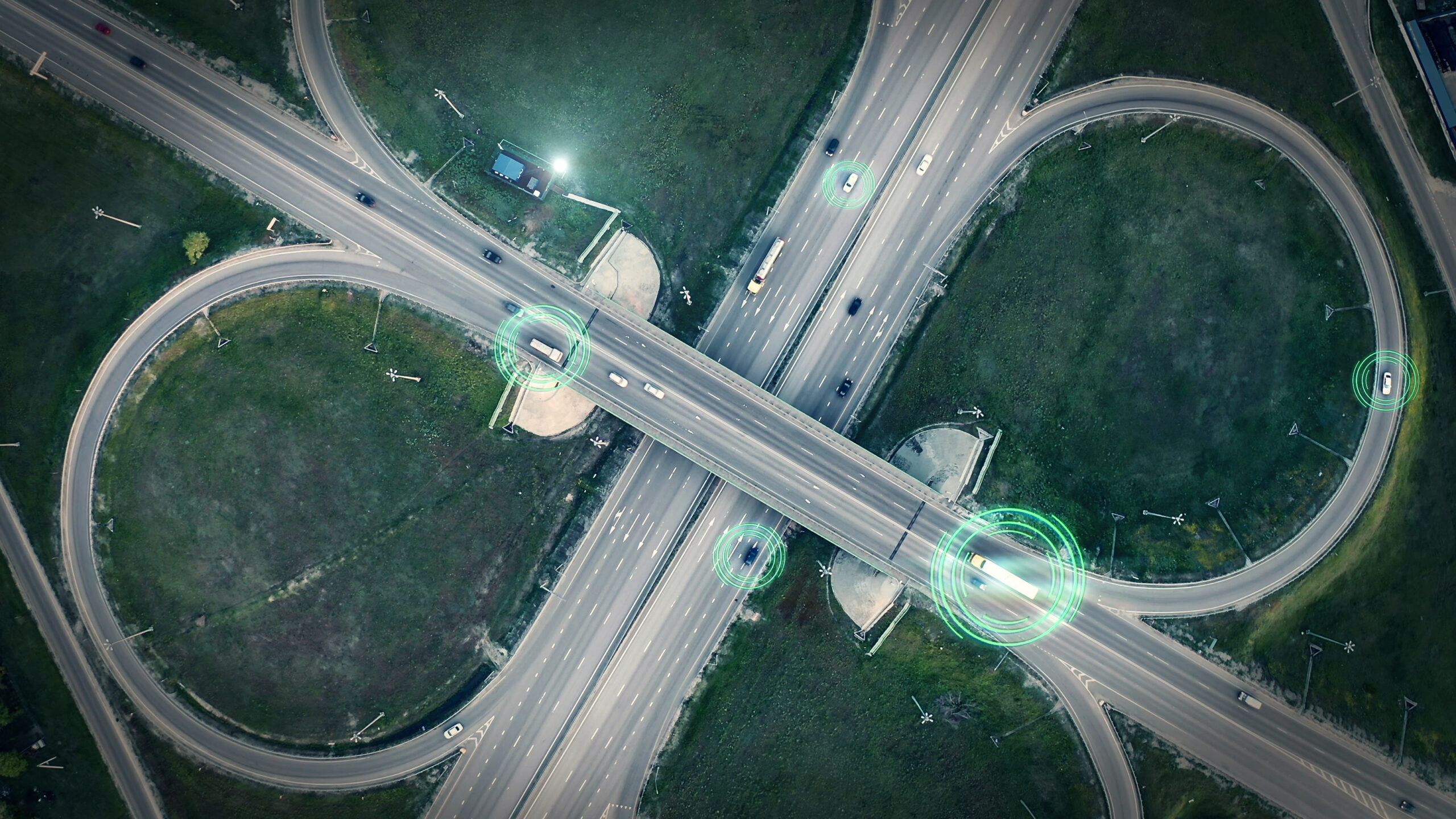 GPS navigation and autonomous driverless transportation concept. Aerial view of transport junction with cars and trucks driving with digital green circles, future global technology on roads