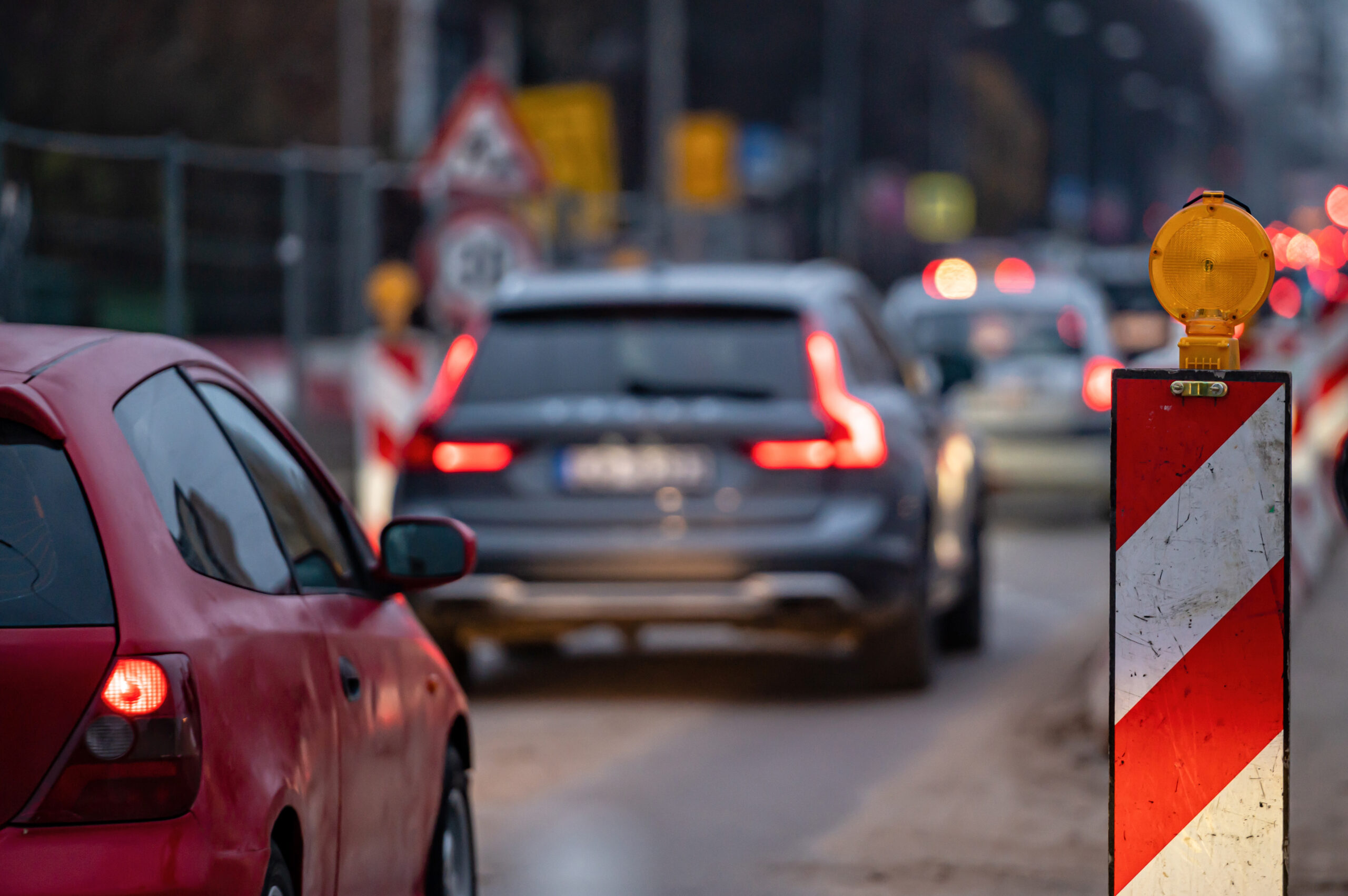 evening traffic jam during road repairs, ntense traffic flow of in cars rush hours